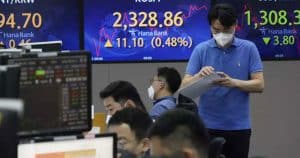 Asian markets mixed as traders steel for more rate hikes