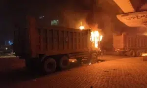 dumpers torched in Karachi