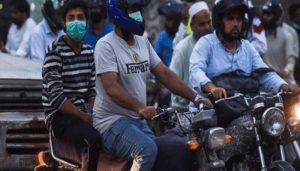 Govt bans pillion riding & face coverings in public