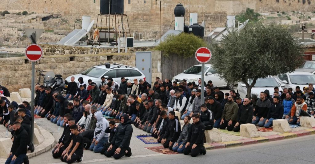 Palestinians hold Friday prayers on streets after Al-Aqsa closure