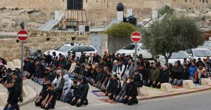 Palestinians hold Friday prayers on streets after Al-Aqsa closure